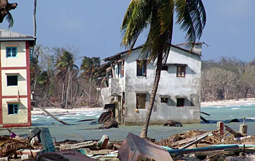 Homes on India's Nicobar Islands permanently submerged due to subsidence from the 2004 Indian Ocean earthquake. Source: